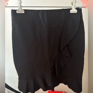 Cute mini black skirt with ruffle design